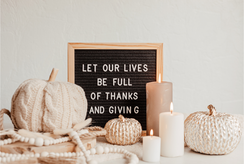 Thanksgiving decor with candles and message board.